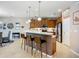 Modern kitchen with pendant lighting, breakfast bar, stainless steel appliances, and ample cabinetry at 6240 Falcon Lair Dr, North Port, FL 34287