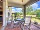 Screened patio with a tile floor, a ceiling fan and beautiful outdoor view at 6240 Falcon Lair Dr, North Port, FL 34287