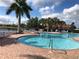 Resort-style pool with ample lounge chairs and inviting turquoise water, perfect for relaxation and recreation at 6240 Falcon Lair Dr, North Port, FL 34287