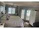 Comfortable bedroom with views of the ocean and hardwood floors at 652 N Elm St, Englewood, FL 34223