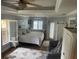 Bright bedroom features hardwood floors, ensuite bathroom access, and natural light at 652 N Elm St, Englewood, FL 34223