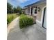 Inviting front entrance with manicured landscaping and decorative touches, creating a warm welcome at 652 N Elm St, Englewood, FL 34223