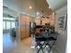 Modern kitchen with stainless steel appliances, and bar seating at 652 N Elm St, Englewood, FL 34223