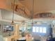 Open-concept living area featuring beautiful ceiling artwork and modern decor at 652 N Elm St, Englewood, FL 34223