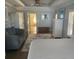 Spacious main bedroom with ensuite bathroom and neutral colored decor at 652 N Elm St, Englewood, FL 34223