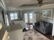 Bright main bedroom with neutral tones, private sitting area, and serene atmosphere at 652 N Elm St, Englewood, FL 34223