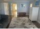 The main bedroom features a sitting area, beautiful floors, and an en-suite bathroom at 652 N Elm St, Englewood, FL 34223