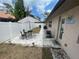 Relaxing fenced patio with pavers, outdoor table and chairs at 652 N Elm St, Englewood, FL 34223
