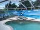 Beautiful pool and spa with painted mural offers a serene escape at 652 N Elm St, Englewood, FL 34223