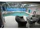 Relaxing outdoor pool area complete with a spa and screened enclosure at 652 N Elm St, Englewood, FL 34223