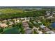 Real estate aerial view of the community, showcasing lakes and green spaces at 6617 Cheswick St, Sarasota, FL 34243