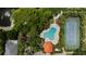 Enjoy this aerial showcasing a pool, tennis court, and gazebo at 6617 Cheswick St, Sarasota, FL 34243