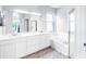 Bright bathroom features a double vanity, soaking tub, and separate shower at 6617 Cheswick St, Sarasota, FL 34243