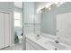 Light and bright bathroom with a double sink vanity and toilet at 6617 Cheswick St, Sarasota, FL 34243