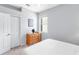 Clean bedroom with a closet, light walls, carpet flooring and natural lighting through the window at 6617 Cheswick St, Sarasota, FL 34243