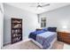 Comfortable bedroom with a ceiling fan, carpet flooring, a window, and dresser at 6617 Cheswick St, Sarasota, FL 34243