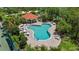 Community pool area with lounge chairs and tables for residents to enjoy at 6617 Cheswick St, Sarasota, FL 34243