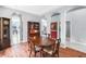 Traditional dining room with wood floors, arched doorways, and elegant furniture with vintage touches at 6617 Cheswick St, Sarasota, FL 34243