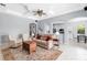 Spacious living room with decorative ceilings, tile flooring, and elegant furnishings at 6617 Cheswick St, Sarasota, FL 34243