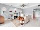 Living room featuring built-in shelving and tile floors at 6617 Cheswick St, Sarasota, FL 34243