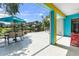 View of the patio that features views of the yard, pond, seating area, and hammock at 6617 Cheswick St, Sarasota, FL 34243