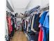 Organized walk-in closet with ample shelving and hanging space for clothes and accessories at 6617 Cheswick St, Sarasota, FL 34243
