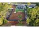 Aerial view of home featuring a fenced in yard, pool, fire pit and manicured landscaping at 6875 Beckwith Ave, North Port, FL 34291