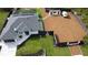 Overhead view of a modern home with a large yard, screened pool, and stylish landscaping, offering a luxurious lifestyle at 6875 Beckwith Ave, North Port, FL 34291