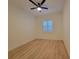Bright bedroom with a window and wood flooring with a contemporary ceiling fan at 6875 Beckwith Ave, North Port, FL 34291