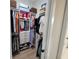 Walk-in closet with custom shelving and storage, ideal for organization and maximizing space at 6875 Beckwith Ave, North Port, FL 34291