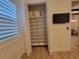Linen closet providing ample storage space with adjustable shelves to keep your belongings organized at 6875 Beckwith Ave, North Port, FL 34291