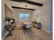 Well decorated dining room featuring a modern chandelier and decorative furniture at 6875 Beckwith Ave, North Port, FL 34291