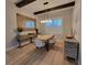 Bright dining room featuring wood beams, chandelier, and large mirror at 6875 Beckwith Ave, North Port, FL 34291