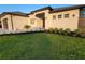 Modern home featuring a well-manicured lawn and a clean, modern exterior at 6875 Beckwith Ave, North Port, FL 34291