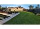 Beautiful single-story home features manicured landscaping, a modern design, and a welcoming entrance at 6875 Beckwith Ave, North Port, FL 34291