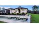 Charming single-story home boasts fresh landscaping, a modern design, and a welcoming entrance at 6875 Beckwith Ave, North Port, FL 34291