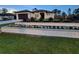 Charming home featuring manicured landscaping, a well-maintained lawn, and a stylish exterior at 6875 Beckwith Ave, North Port, FL 34291