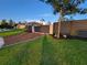View of grass and modern privacy fence and gate, leading to the home and front yard at 6875 Beckwith Ave, North Port, FL 34291