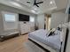 Serene main bedroom featuring tray ceilings, neutral colors, and plenty of natural light at 6875 Beckwith Ave, North Port, FL 34291