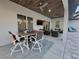 Outdoor patio area with seating, a ceiling fan, and an outdoor television, ideal for entertaining guests at 6875 Beckwith Ave, North Port, FL 34291