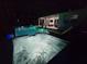 Nighttime view of a pool and spa with decorative lighting, perfect for evening relaxation at 6875 Beckwith Ave, North Port, FL 34291