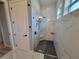 Sleek glass enclosed shower with gray tile and modern fixtures at 6875 Beckwith Ave, North Port, FL 34291