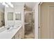 Clean bathroom with a glass door shower, double sink vanity, and ample lighting at 7019 River Hammock Dr # 306, Bradenton, FL 34212