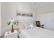 Cozy bedroom with a comfortable bed, stylish lamp, and closet space at 7019 River Hammock Dr # 306, Bradenton, FL 34212