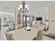 Open concept dining area that flows into a kitchen and living space at 7019 River Hammock Dr # 306, Bradenton, FL 34212