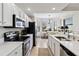 Modern kitchen with stainless steel appliances and ample natural light at 7019 River Hammock Dr # 306, Bradenton, FL 34212