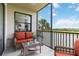 Relaxing screened lanai with comfortable seating, offering serene views of the lush landscaping and waterway at 7019 River Hammock Dr # 306, Bradenton, FL 34212