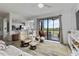 Open-concept living room with a view of the screened-in patio at 7019 River Hammock Dr # 306, Bradenton, FL 34212
