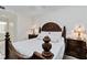 Elegant main bedroom featuring beautiful lamps and wood furniture at 7019 River Hammock Dr # 306, Bradenton, FL 34212