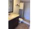 A full bathroom with tile floors and a tiled stand up shower at 725 Capri Isles Blvd # 217, Venice, FL 34292